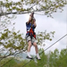 Thumbnail of boy going down a zipline at Sky High